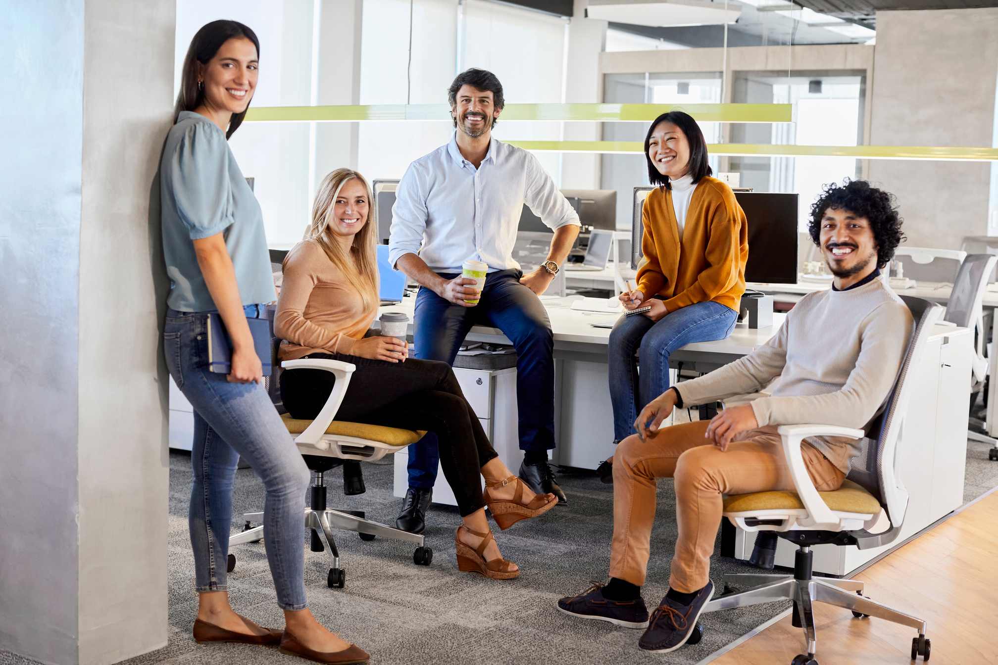 Portrait of happy entrepreneurs at workplace